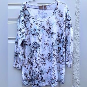 Chicos size 3 T-shirt.  White background, black,grey, teal ish blue swirls
